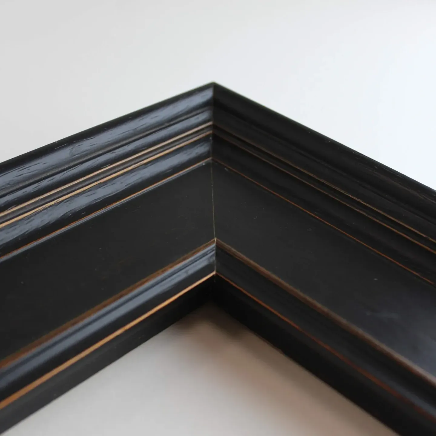 Black frame with gold trim corner