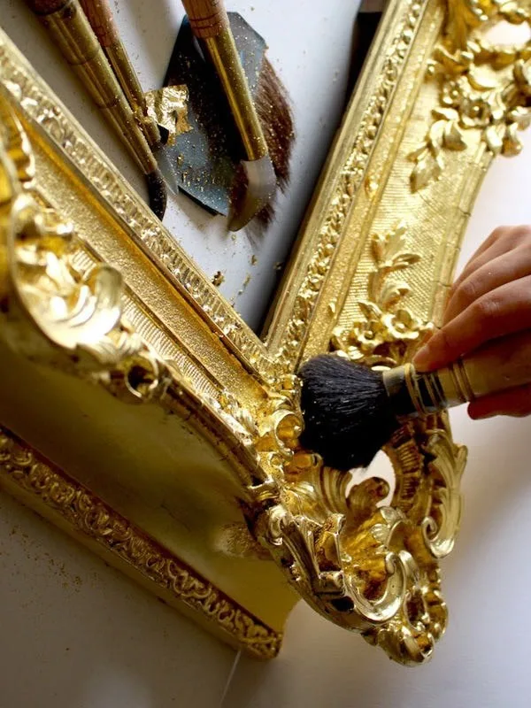 Gold leaf gilding in progress