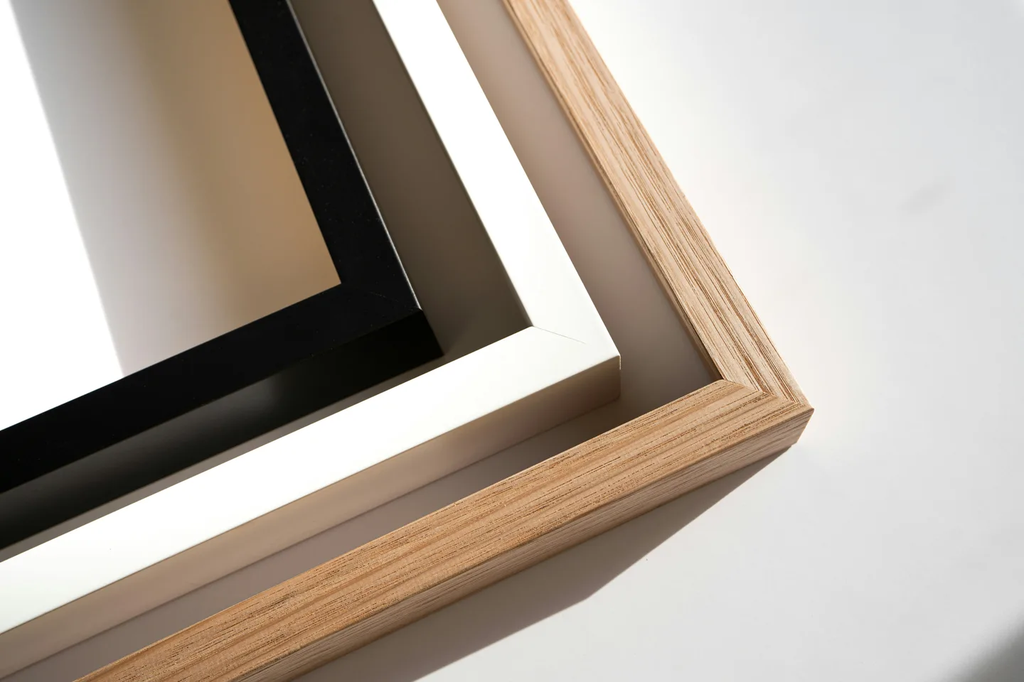 Black, white and natural wood frame corners